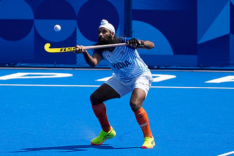 Jarmanpreet Singh stops the ball during match against Argentina